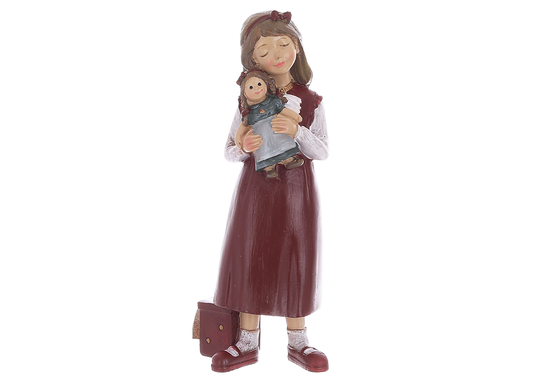 Retro-style decorative figurine of a girl with a doll